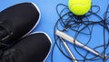 Sport equipment, sneakers on blue background
