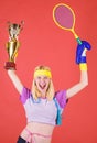 Sport equipment store. Sport shop assortment. Girl cheerful successful modern woman hold golden goblet of sport champion Royalty Free Stock Photo