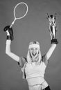 Sport equipment store. Sport shop assortment. Girl cheerful successful modern woman hold golden goblet of sport champion Royalty Free Stock Photo