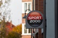 Germany , Finsterwalde , 18.10.2021 , The advertising sign for Sport 2000 on a facade