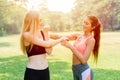 Sport exercise personal trainer teaching student to warm up and stretching her arm and shoulder