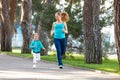 Sport family. Mother and baby daughter jogging run on nature Royalty Free Stock Photo