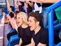 Sport fans clapping and singing on tribunes Royalty Free Stock Photo