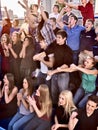 Sport fans clapping and singing on tribunes. Royalty Free Stock Photo