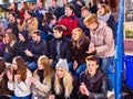 Sport fans clapping and singing on tribunes. Royalty Free Stock Photo