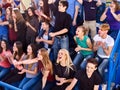 Sport fans clapping and singing on tribunes. Royalty Free Stock Photo