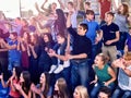 Sport fans clapping and singing on tribunes Royalty Free Stock Photo