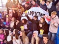 Sport fans holding champion banner on tribunes. Royalty Free Stock Photo