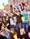 Sport fans holding champion banner on tribunes