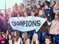 Sport fans holding champion banner on tribunes Royalty Free Stock Photo