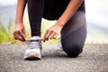 Sport, feet of woman tying sneakers and runner on road for safety during outdoor marathon training. Running, cardio Royalty Free Stock Photo