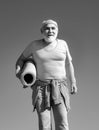 Sport. Fit senior man resting after working out. Grandfather pensioner. Elderly man practicing sports on blue sky Royalty Free Stock Photo