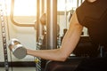 Sport, fitness, bodybuilding, weightlifting and people concept - close up of woman flexing arms with dumbbell in gym Royalty Free Stock Photo