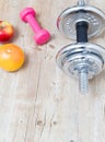 Sport fitness diet concept weights dumbbell and fruit Royalty Free Stock Photo