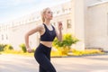 Sport and Fitness. Fit Woman Running City Street Summer Sunny Morning Caucasian Athletic Female Jogging Outdoor Cardio Training Royalty Free Stock Photo