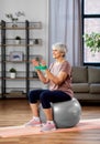 senior woman exercising with elastic band at home Royalty Free Stock Photo