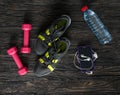 Sport fitness items on dark wooden background