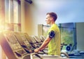 Man with smartphone exercising on treadmill in gym Royalty Free Stock Photo