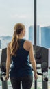 Sport, fitness, lifestyle, technology and people concept - woman exercising on treadmill in gym against the background Royalty Free Stock Photo