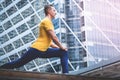 Sport fitness man streching in modern city morning