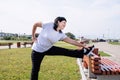 Smiling senior woman warming up stretching outdoors in the park Royalty Free Stock Photo