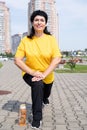 Smiling senior woman warming up stretching outdoors in the park Royalty Free Stock Photo