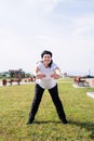 Smiling senior woman warming up stretching outdoors in the park Royalty Free Stock Photo