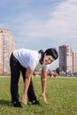 Smiling senior woman warming up stretching outdoors in the park Royalty Free Stock Photo