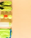 Sport, fitness, tennis, healthy lifestyle, sport stuff. Lime trainers, tennis ball, lime athletic shorts, sports bottle. Flat lay,