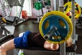 Man during bench press exercise in gym
