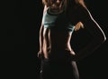 Sport fitness woman training on dark background. Beautiful body Royalty Free Stock Photo