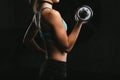 Sport fitness woman training on dark background. Beautiful body Royalty Free Stock Photo