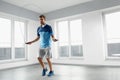 Sport Fitness Workout. Healthy Man Skipping Jump Rope Indoors. Royalty Free Stock Photo