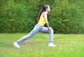 Sport, fitness, yoga concept - young woman is doing stretching