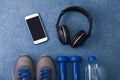 Sport flat lay composition dumbbells shoes water headphones