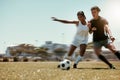 Sport, friends and soccer with man and woman playing on a soccer field, competitive training for sports goal. Fitness