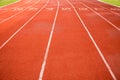 Sport, game, competition and exercise concept.red rubber racetracks running lane with number and line in white color. Jogging Royalty Free Stock Photo