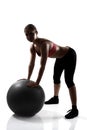 Sport girl doing hands and legs exercise with fitness ball, silh