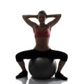 Sport girl doing hands and legs exercise with fitness ball, silh