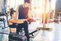 Sport girl doing weight exercises working with heavy dumbbells