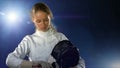 Sport girl fencer with epee before competition preparing for battle