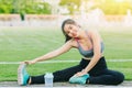 Sport girl teen exercise leg stretching warmup or cool down muscle for runner morning Royalty Free Stock Photo