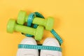 Sport and gym fitness objects on yellow background