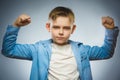 Sport Handsome Boy. Strong serious kid showing his hand biceps muscles Royalty Free Stock Photo