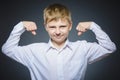 Sport Handsome Boy. Strong serious kid showing his hand biceps muscles Royalty Free Stock Photo