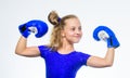 Sport and health concept. Boxing sport for female. Be strong. Girl child with blue gloves posing on white background