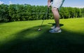 Sport Healthy. Golf game. Man golfer action win after long putting golf ball on green