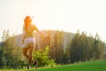 Sport Healthy. Golfer asian sporty woman relax on fairway for the put golf ball on the green golf evening time in vacations day. Royalty Free Stock Photo