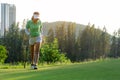 Sport Healthy. Golfer asian sporty woman walking relax on fairway for the put golf ball on the green golf evening time in vacation Royalty Free Stock Photo