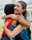 Sport, hug and student girl game match showing support, trust and teamwork on a outdoor field. Student soccer or netball